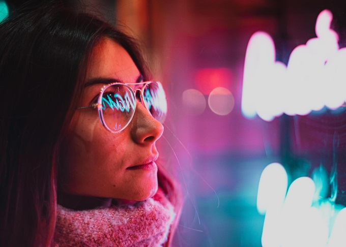 Young Woman reading a sign