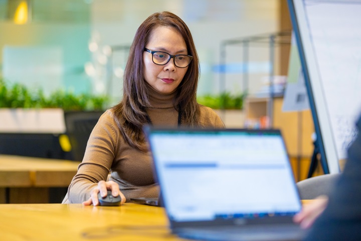 A woman working at her laptop