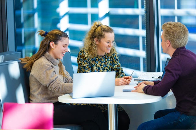 Three people working together