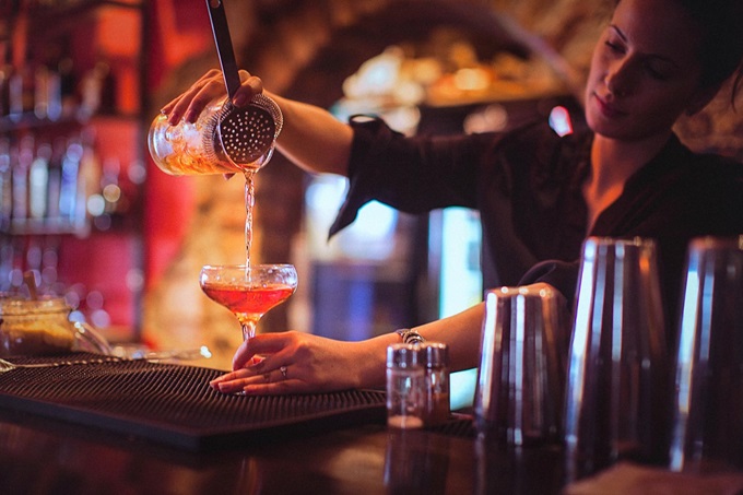 Bartender pouring a cocktail