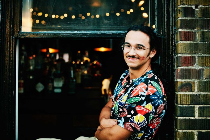 Man sitting in pub window